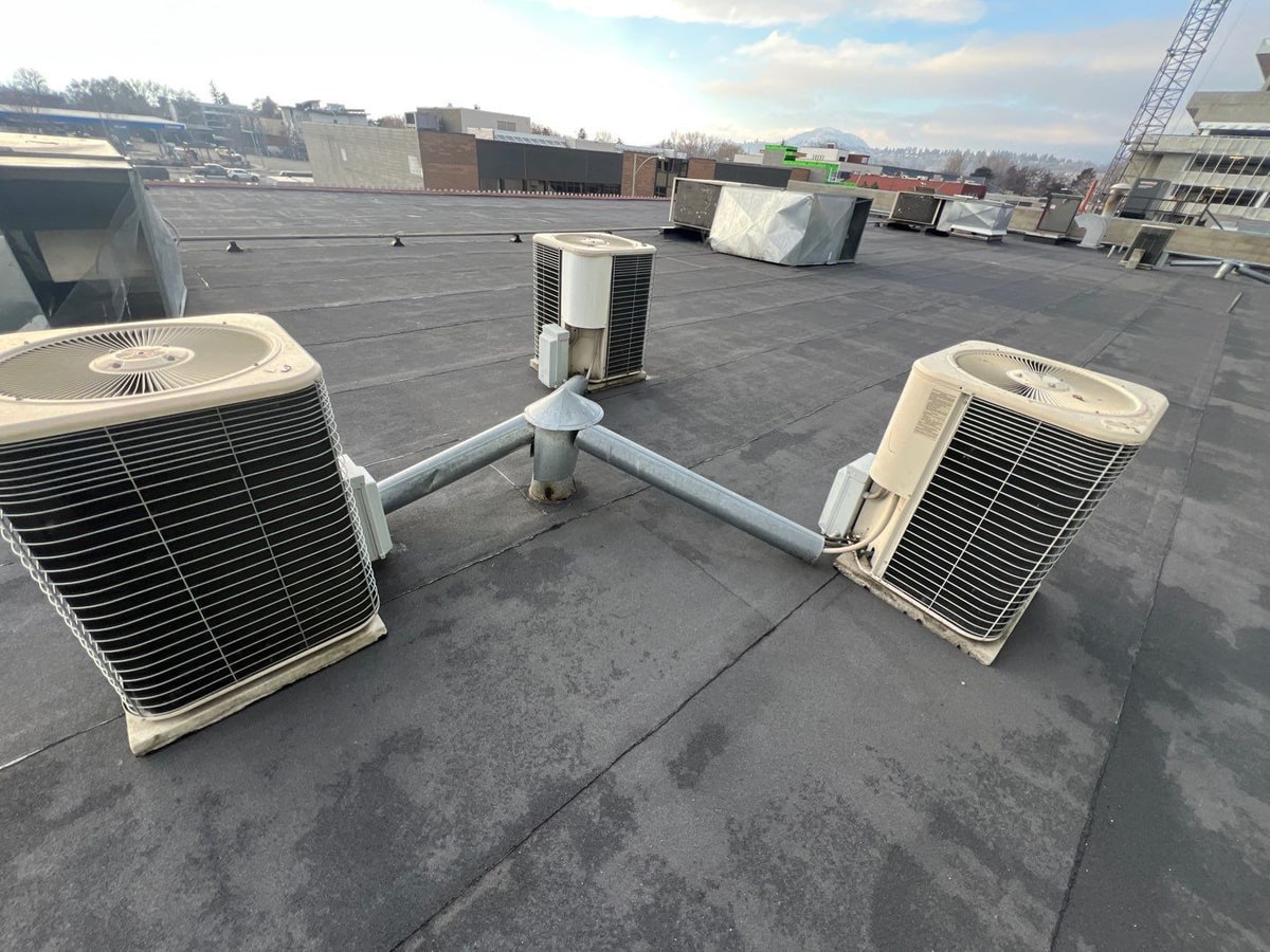 The same two units on the new torch-on roof