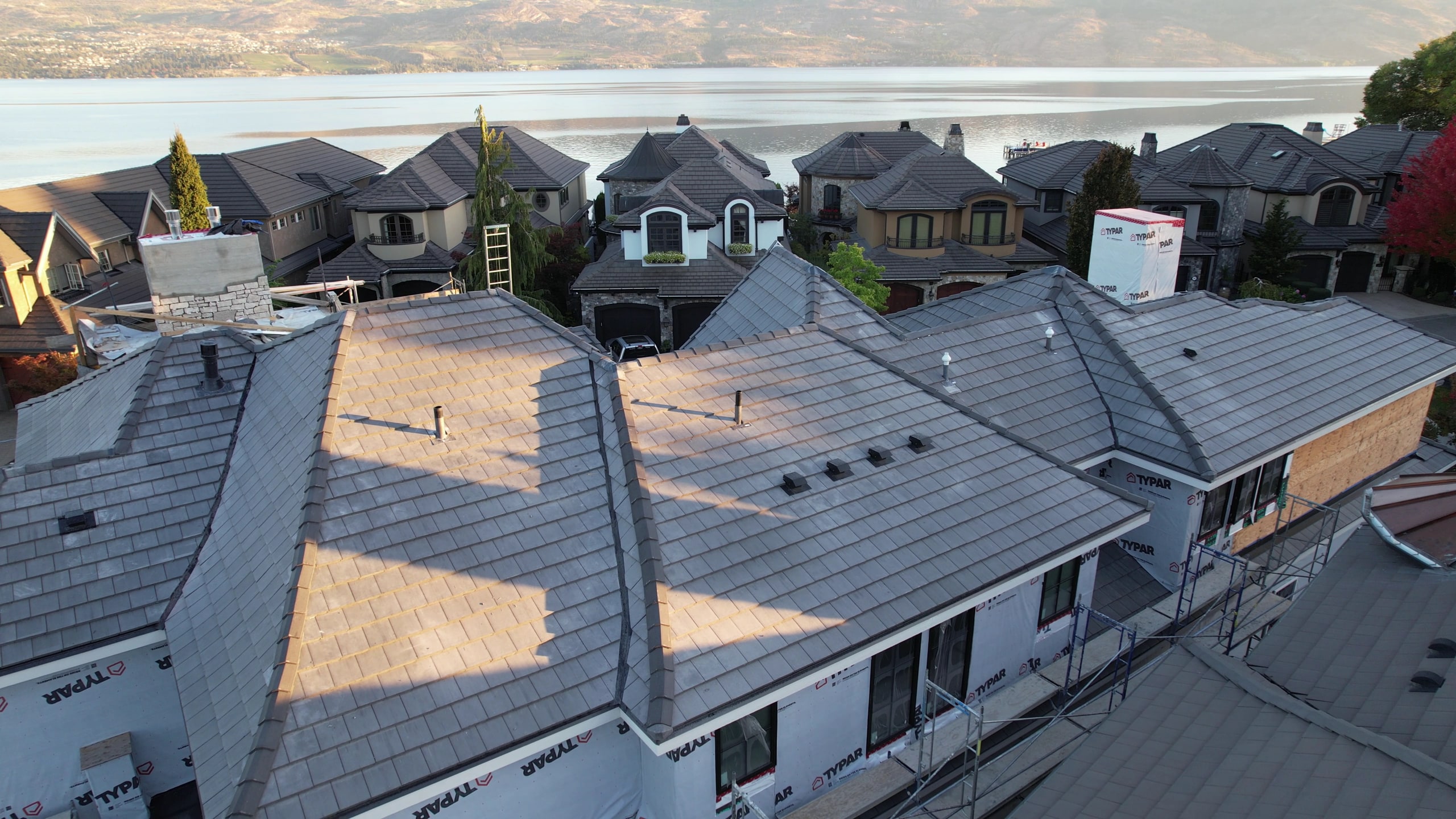 Concrete tile roof on a lakefront home, Okanagan Lake beyond
