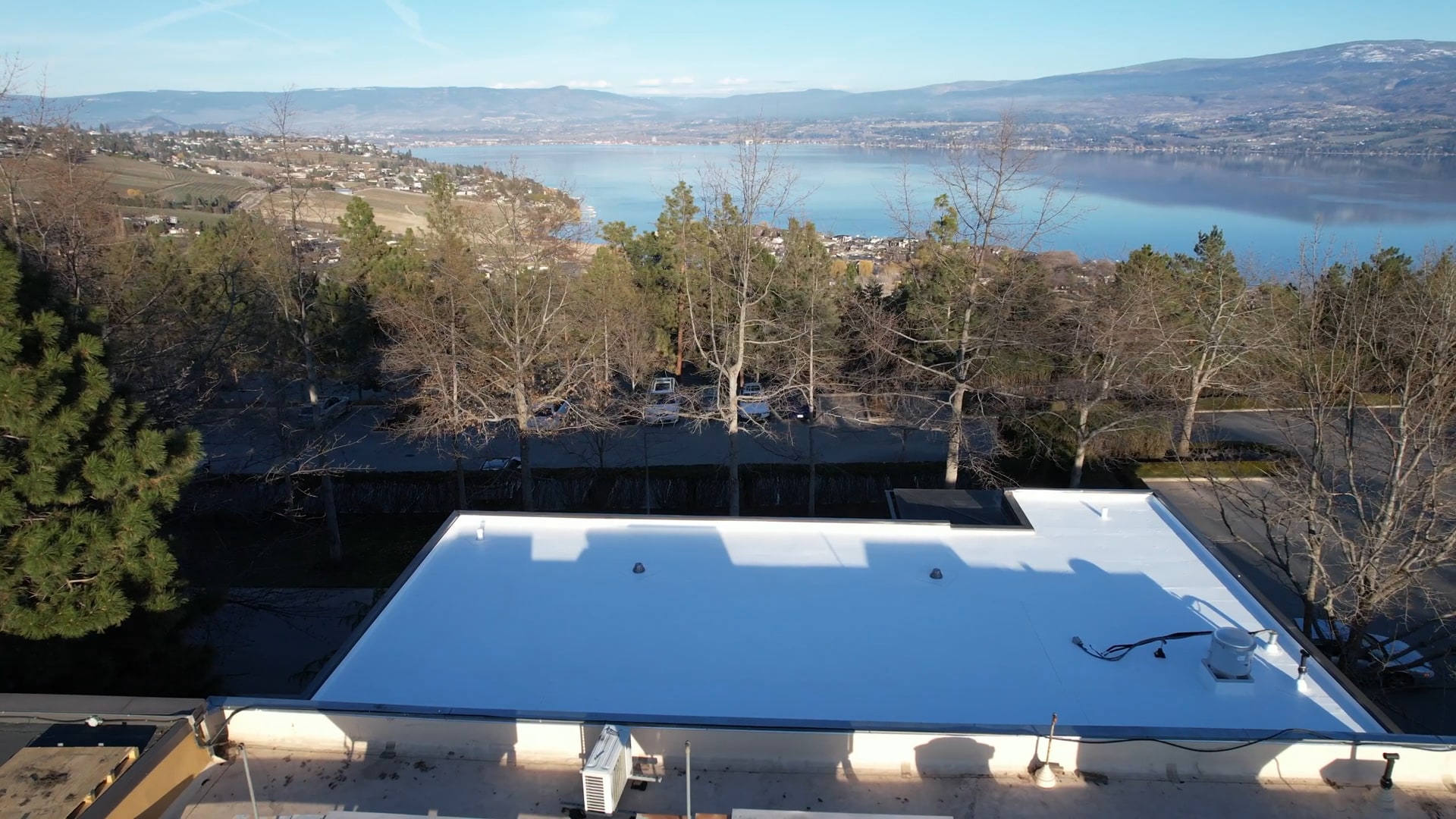 Finished white TPO roof on a winery, Okanagan Lake and the valley beyond